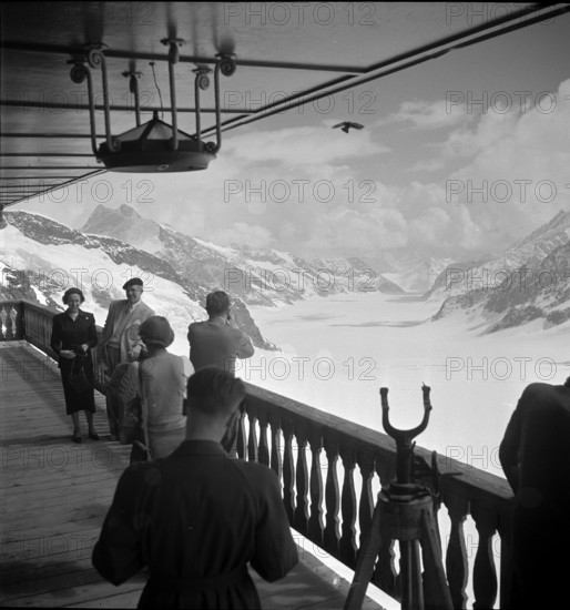 Tourists enjoy the view at the Kleine Scheidegg; 1957