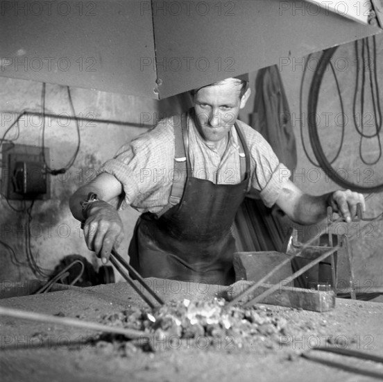 Forge, nailer making nails; 1940