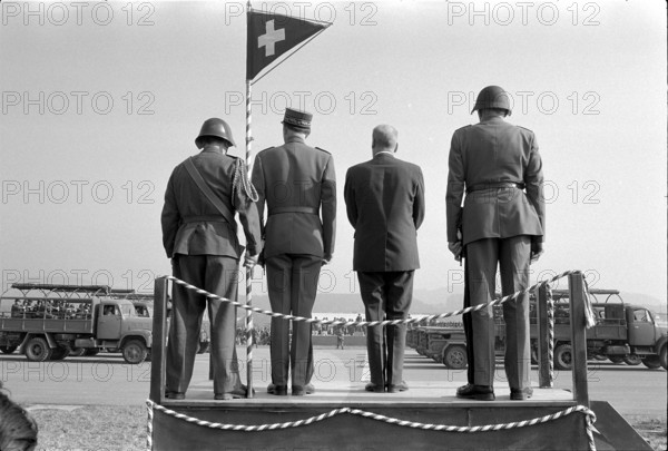 Swiss Army Parade in Emmen; Rudolf Gnägi between military personnel 1972