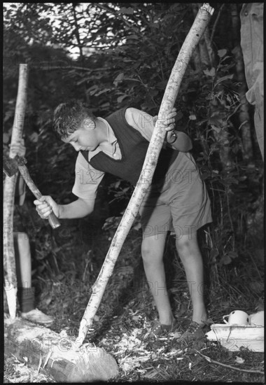 English boy scout carving, 1950