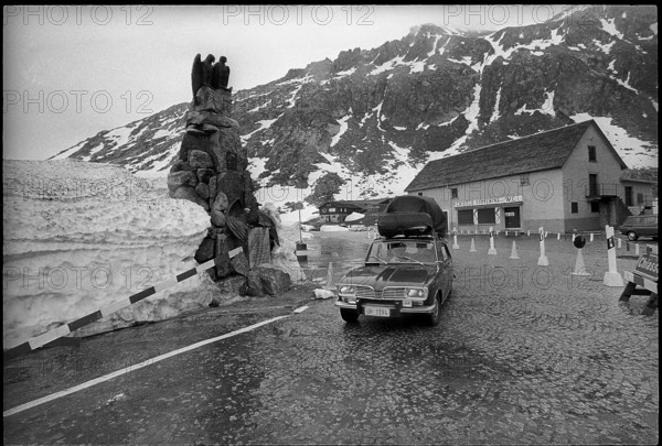 Car on Gotthard pass at season opening 1971
