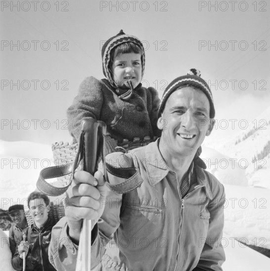 Bedretto valley, evacuation because of danger of avalanches 1951: Men leaving village, walking on skis