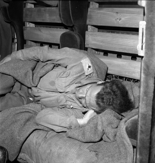 Sleeping soldier of British Army on train back home 1945