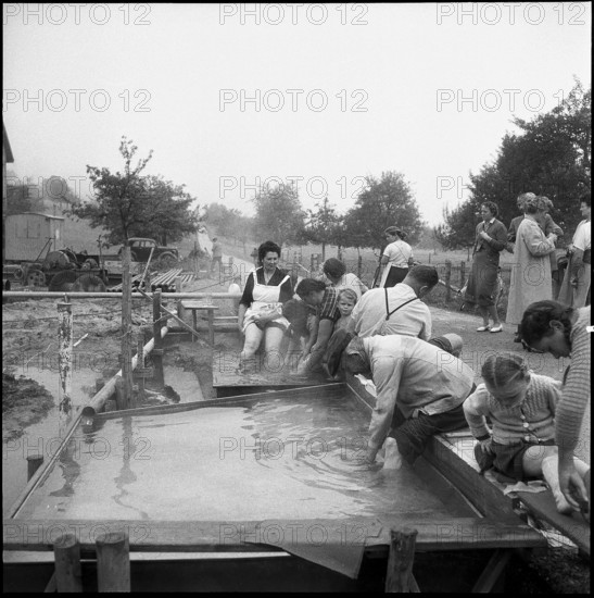 People enjoy Zurzach thermal spring; 1955