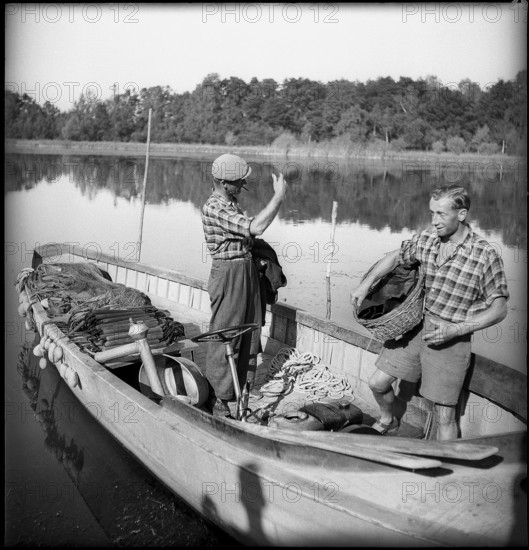 Swiss fishermen on Lake Constance on fishing boat 1945