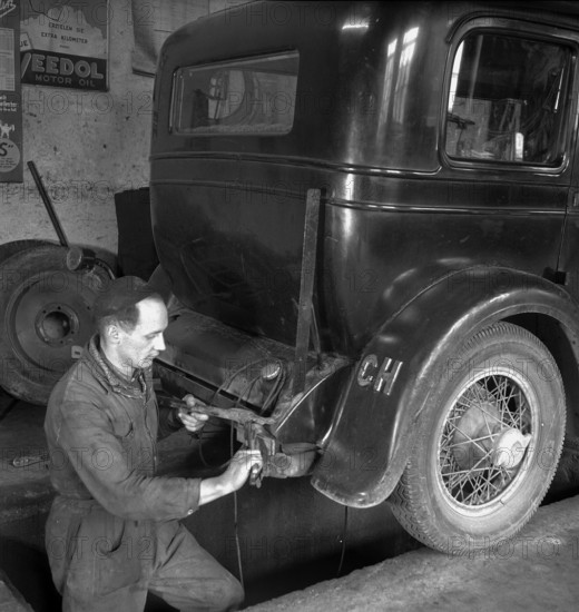 Motor mechanic at work; 1947
