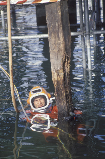 Rebuilding of Chapel bridge; diver controlling wooden pile 1994