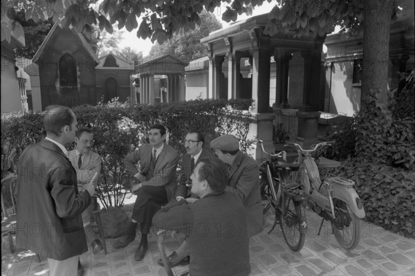 Men in a cemetery in Paris 1968
