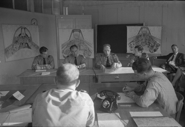 Military pilots discussing tactical exercise, Dübendorf 1963