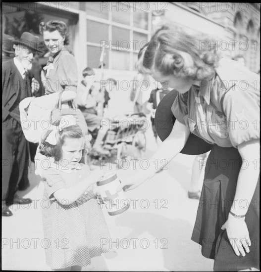 May 8th. 1945, Armistice's day: Woman collects money for the Swiss donation