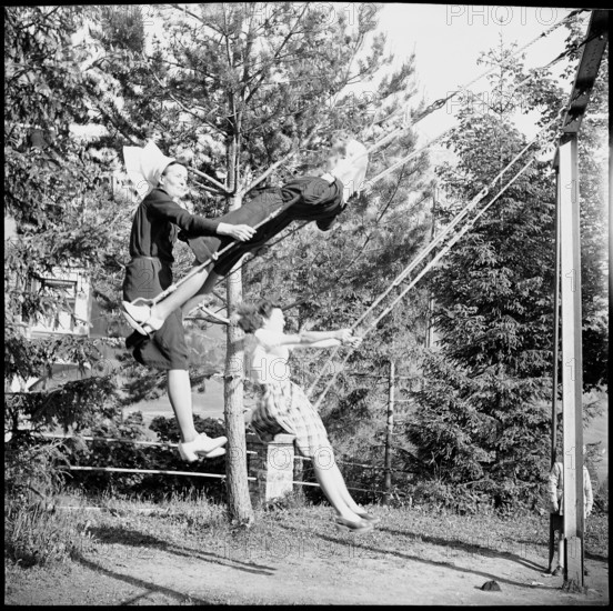 Young nurses swinging in the garden