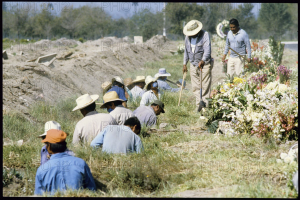Digging graves after earthquake Mexico City 1985