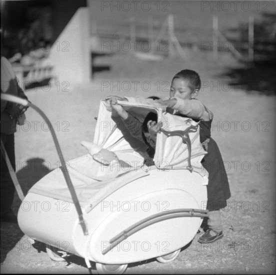 Tibetan child with pram, underwater 1961
