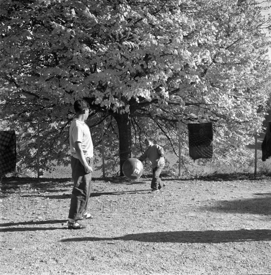 Tibetan playing football, underwater 1961