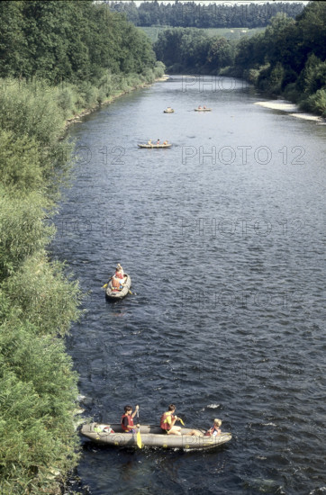 Children canoeing on river