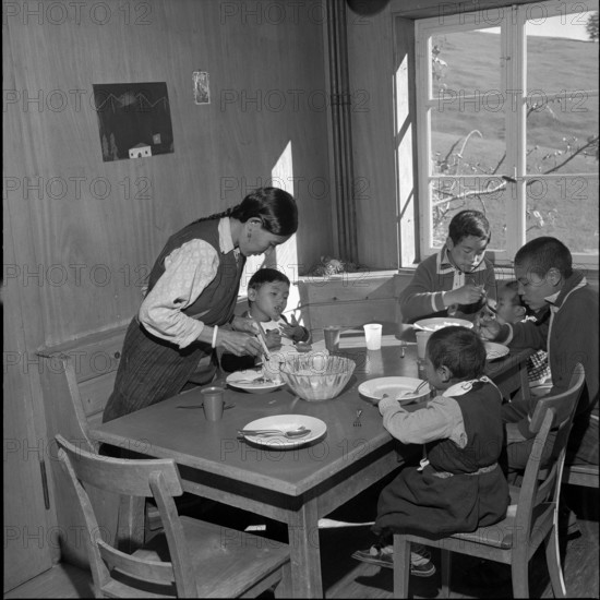 Tibetan refugees at lunch, underwater 1961