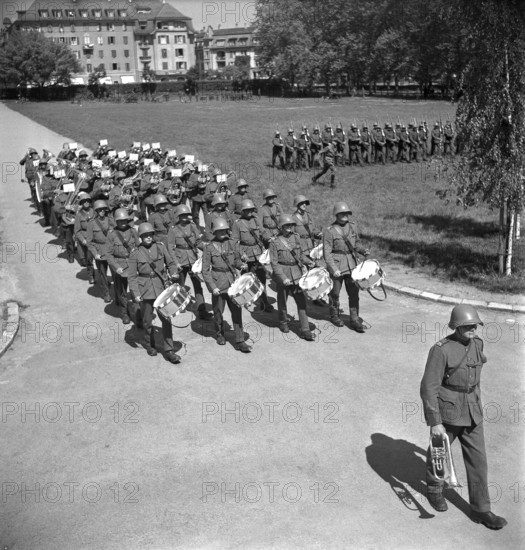 Drummers tabouring; soldiers marching; 1942