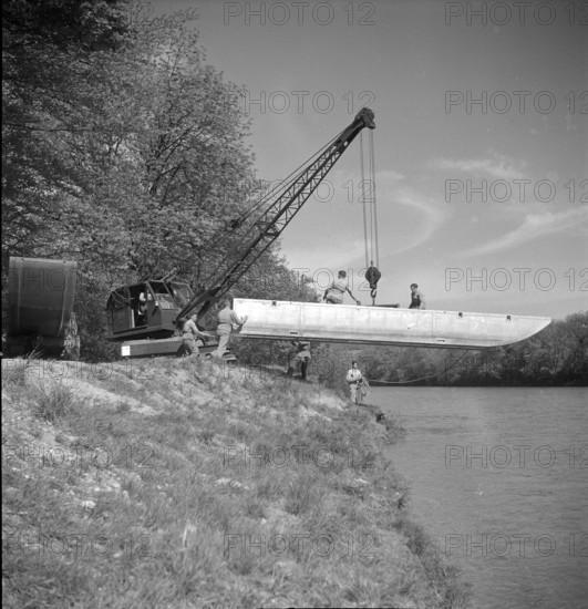 crane putting pontoon boat into Aare, Brugg 1950