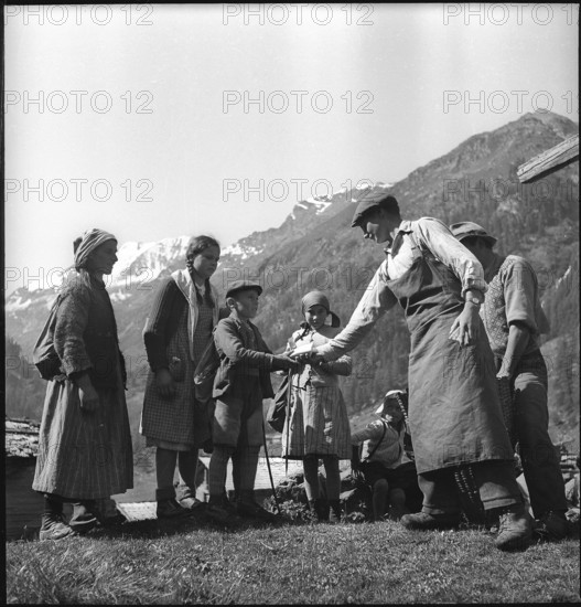 Cheese donation in the Turtmanntal valley, Switzerland, 1940