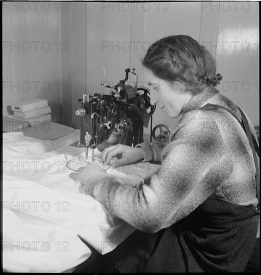 Home embroideress at work, 1942