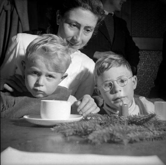 Mother with her children at Christmas, 1952