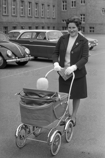 Woman with stroller and voting card 1963