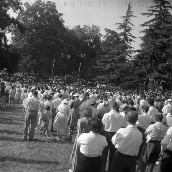 Audience listening to Baptist preacher Billy Graham in Geneva, 1955
