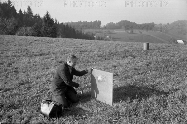 Nature and creatures are artistically treated; Attaching an explosive charge on iron plate Emmental hills arise