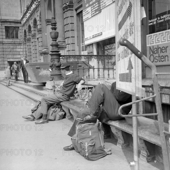 Travelers outside the main station of Zurich, 1956