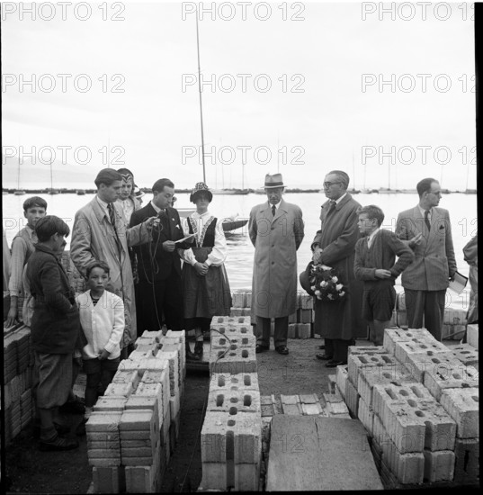 Henri Guisan on transport ship, building materials for rebuilding, 1948