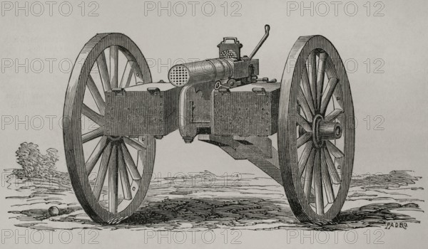 Christophe-Montigny Mitrailleuse. Hand-crank operated. It was developed by the Belgian arms factory of Joseph Montigny between 1859 and 1870. Two ammunition compartments for immediate use were mounted on both sides. Front view. Engraving. ""Historia de la Guerra de Francia y Prusia"" (History of the War between France and Prussia). Volume I. Published in Barcelona, 1870.