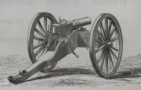 Christophe-Montigny Mitrailleuse. Hand-crank operated. It was developed by the Belgian arms factory of Joseph Montigny between 1859 and 1870. Two ammunition compartments for immediate use were mounted on both sides. Back view. Engraving. ""Historia de la Guerra de Francia y Prusia"" (History of the War between France and Prussia). Volume I. Published in Barcelona, 1870.