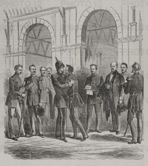 Franco-Prussian War (1870-1871). King William I arriving from Ems, at the Berlin railway station, receives the news of the French declaration of war (19 July 1870). After reading it, he embraces the Royal Prince, who was waiting for him with Bismarck and the generals Helmuth von Moltke, Albrecht von Roon and Friedrich von Wrangel. Engraving. ""Historia de la Guerra de Francia y Prusia"" (History of the War between France and Prussia). Volume I. Published in Barcelona, 1870.