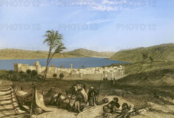 Tiberias and the Sea of Galilee. Engraving by Emile Rouargue. Later colouration. ""La Tierra Santa y los lugares recorridos por los profetas, por los apostoles y por los cruzados"" (The Holy Land and the sites traversed by the prophets, by the apostles and by the crusaders). Published in Barcelona by the printing house of Joaquin Verdaguer, 1840.