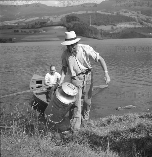 PontlaVille: Farmer brings milk can to cheese factory by boat; 1948