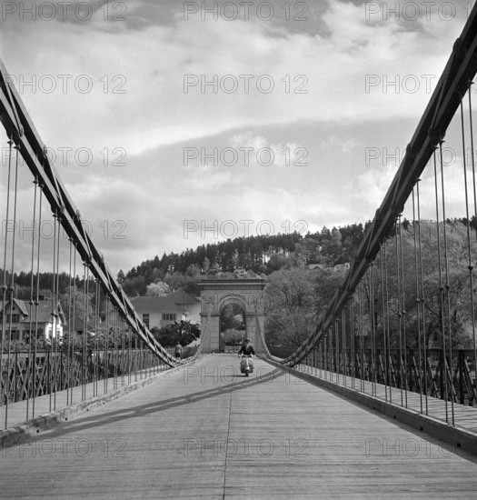 Scooter riders on the Chain Bridge in Aarau, 1947