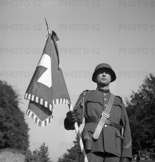 Swiss soldier with Swiss flag, Bargen 1948