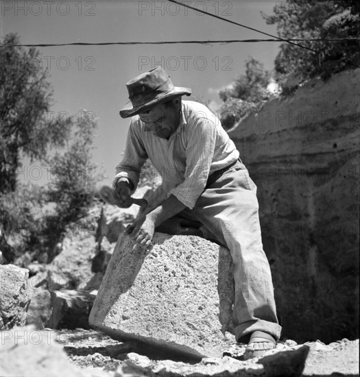 Workers in Saxon tuff quarry; 1947