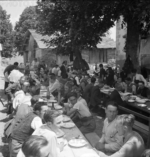 Men at a banquet in the Valais village of Ayent, 1943