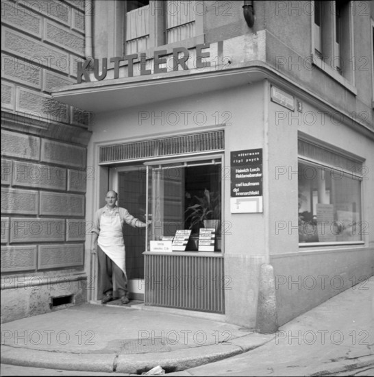 Butcher in front of a tripe shop in Zurich, 1956