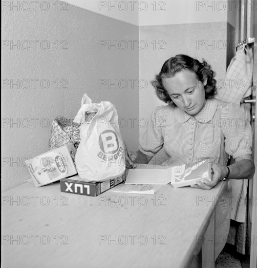 Young woman with her shopping; 1945