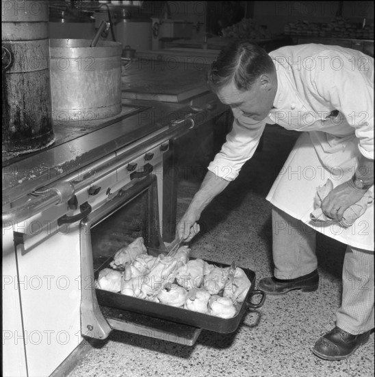 Grande Dixence, construction site cook at the oven 1957