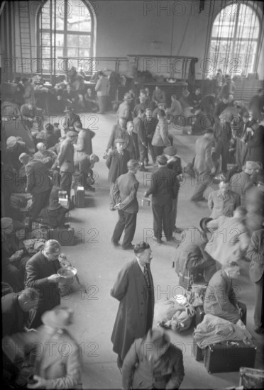 German internees waiting in the station hall. 1945