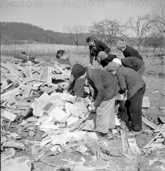 WW 2: bombing Rafz 1945. children, debris