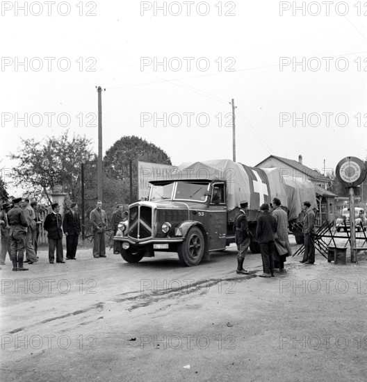 Swiss trucks crossing the border. 1944