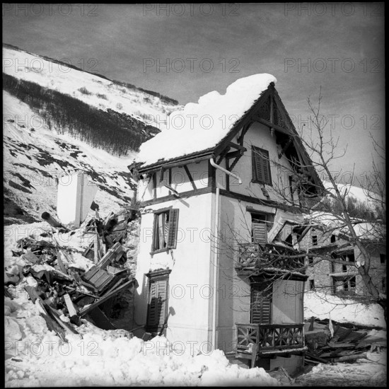 Vals, granary and pylon damaged by avalanche, 1951