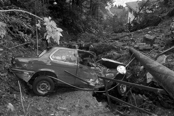 Flood in Ticino, Switzerland 1981: People watching at destructed house