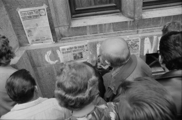 Prague 1968 after the invasion of the Warsaw Pact troops: Man filling up his car in front of the Swiss embassy