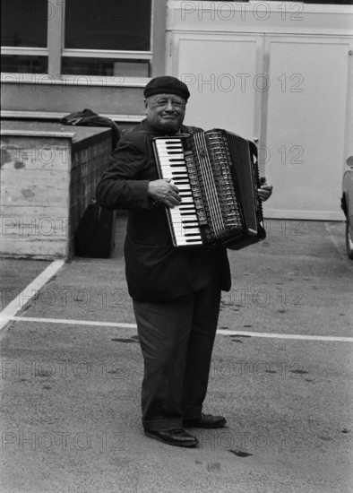 Street musician with accordion, 1968