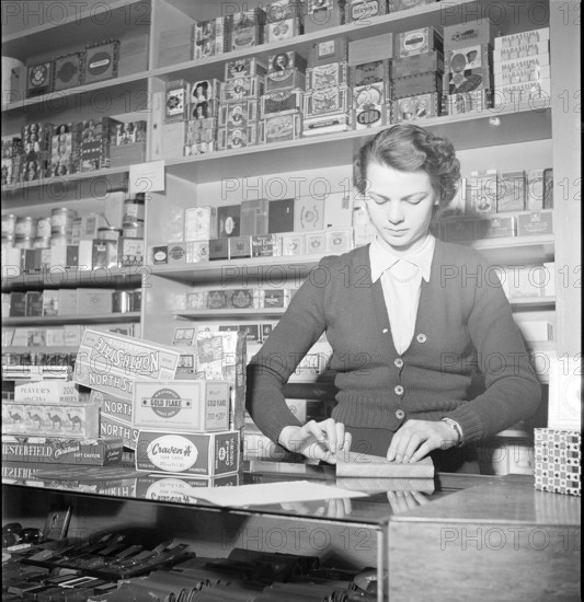 Davos, saleswoman in a tobacco shop; 1949
